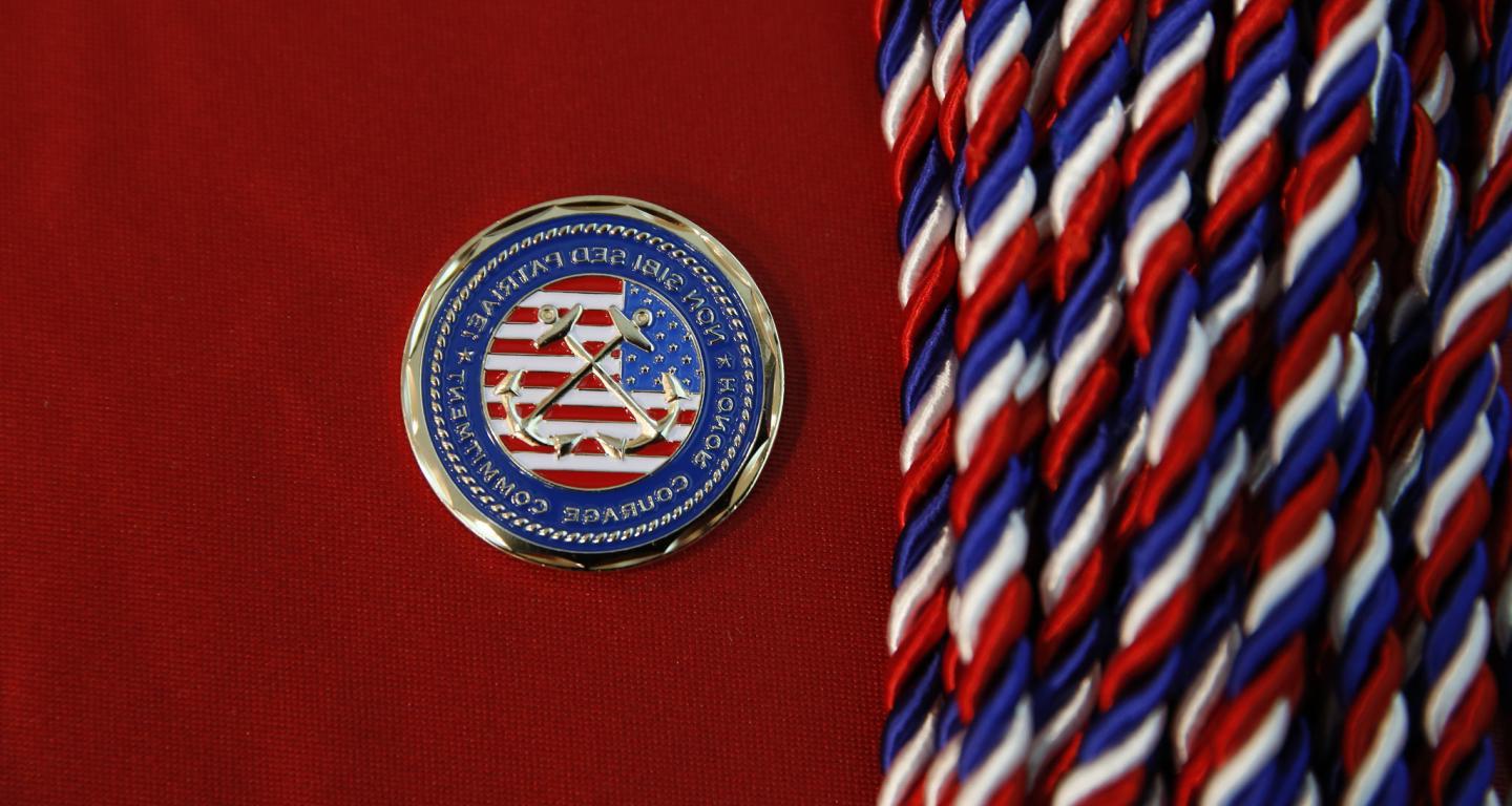 Cords and the seal given to military graduates.