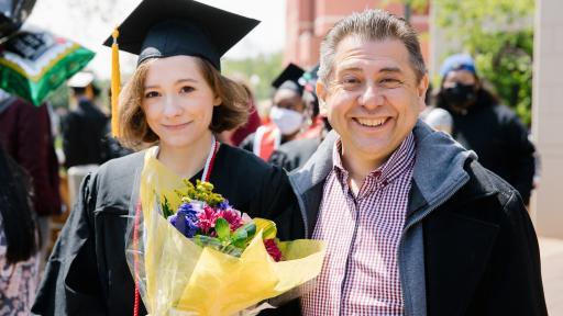 father and daughter posing at graduation